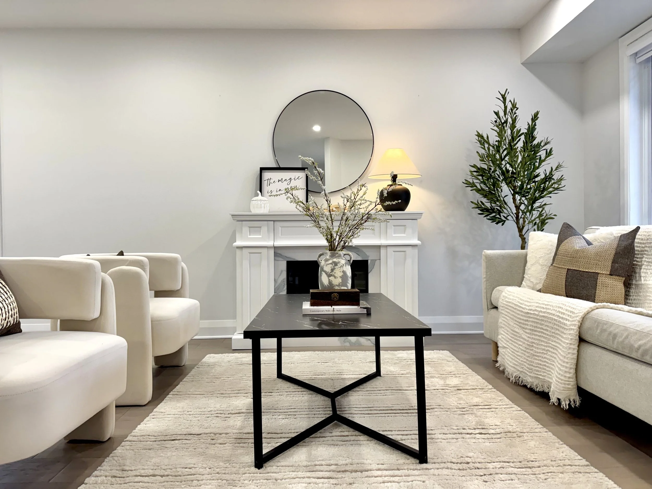 Warm styled living room featuring furniture, artwork, lighting, and decorative pieces available through DW rental services