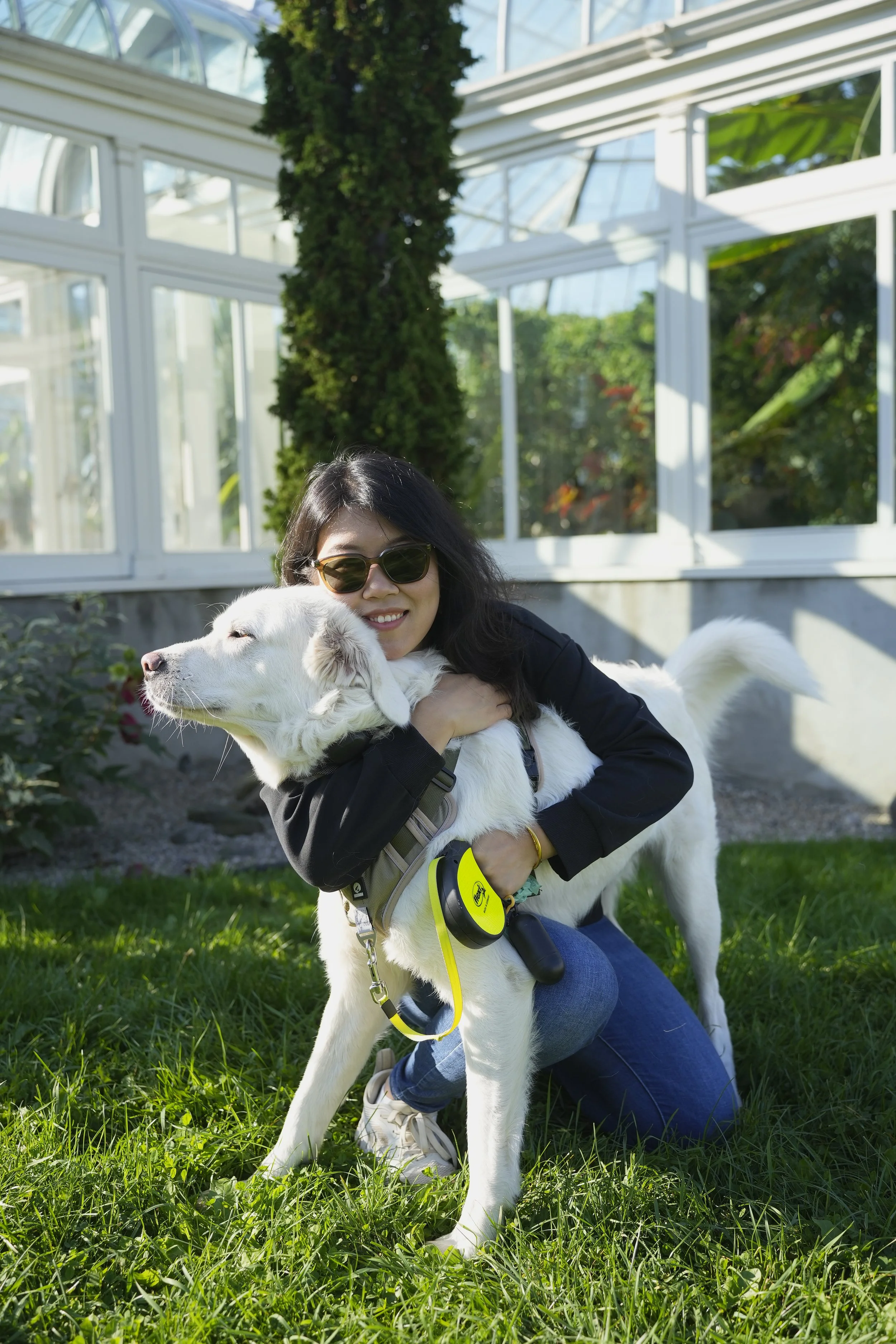 Zidan, founder of DW Home Decor, outdoors with her dog